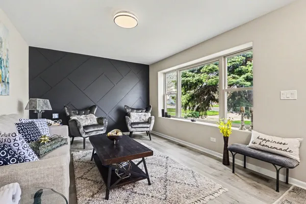 a living room with furniture and a large window