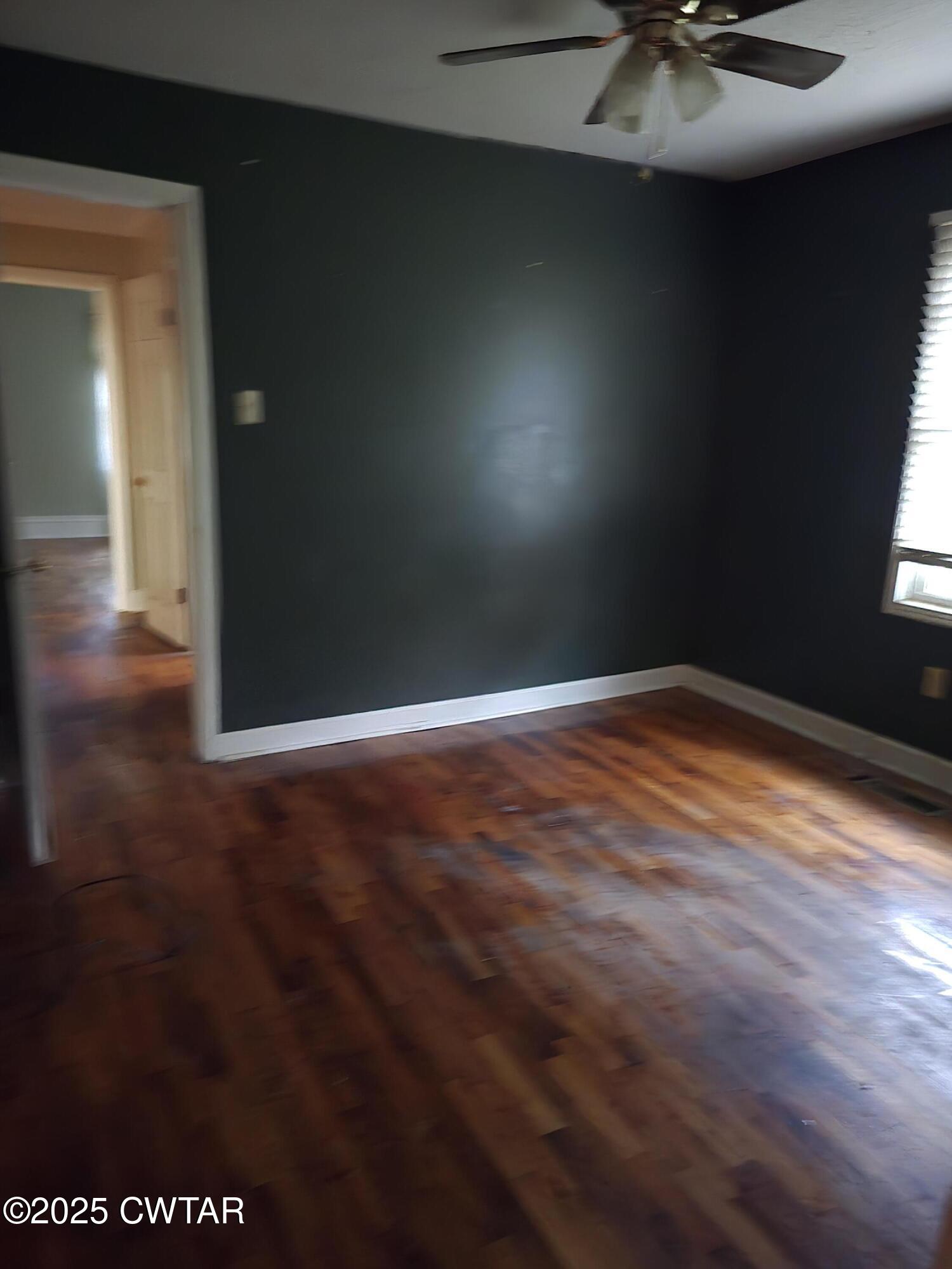 1719 Riverside Drive Jackson, TN 38301 - Photo 8 of 8 a view of empty room with wooden floor