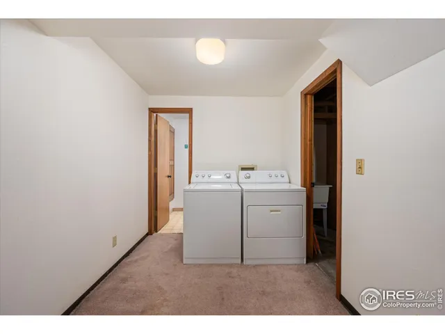 a utility room with a sink dryer and washer