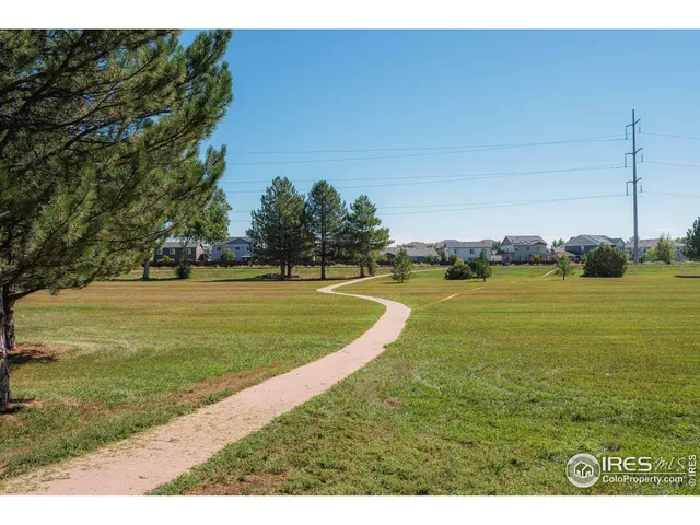 a view of a big yard with an ocean view