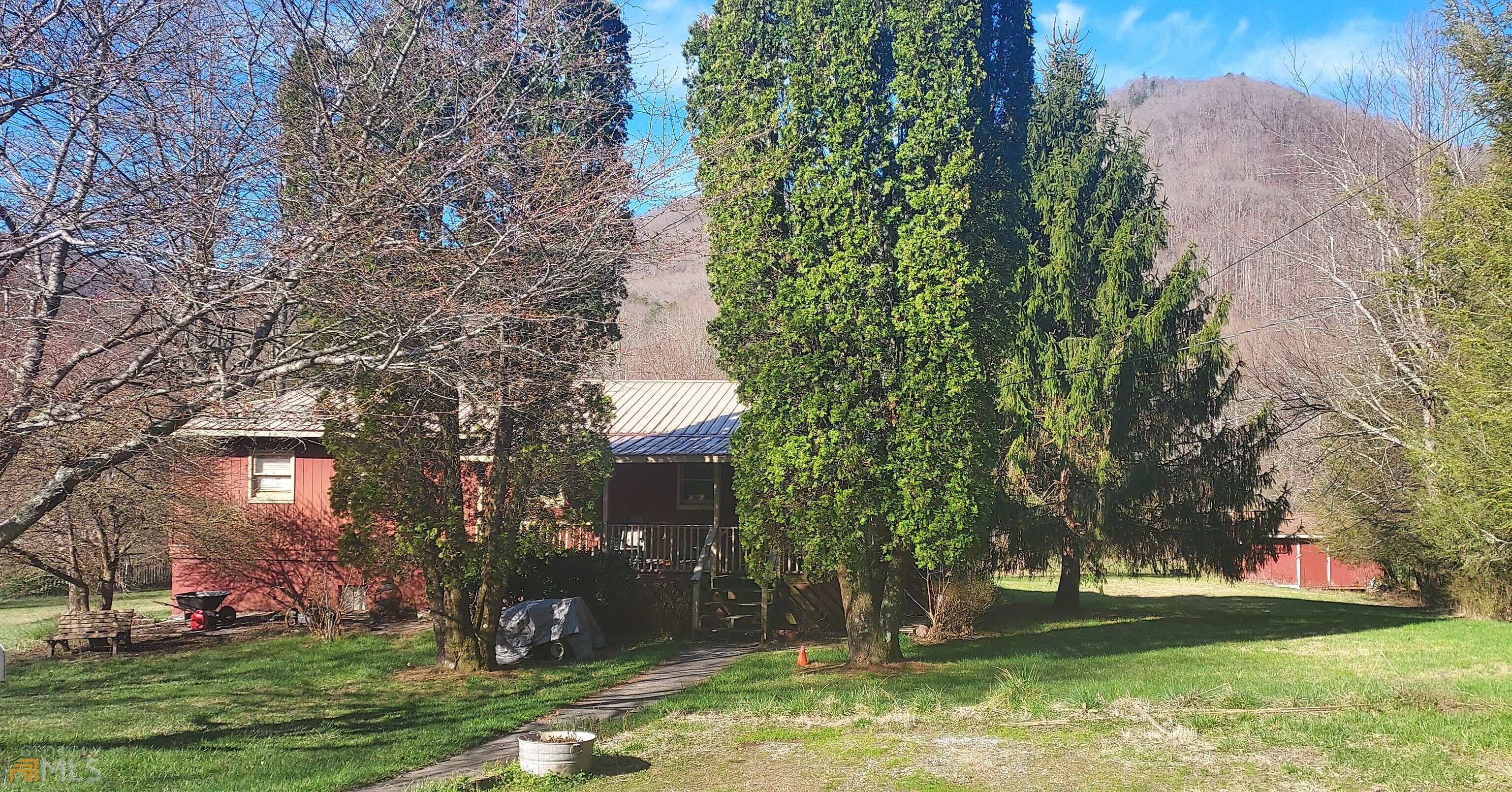 187 McIntosh Lane Rabun Gap, GA 30568 - Photo 1 of 1 front view of a house with a yard and an trees
