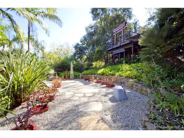 1247 Saxony Road Encinitas, CA 92024 - Photo 17 of 24 Rose garden, with a view of the deck for the garden tea room. Could easily become a private office, sewing room, or...?