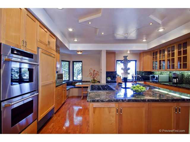 1247 Saxony Road Encinitas, CA 92024 - Photo 6 of 24 Spacious gourmet kitchen, with Sub Zero refrigerator and freezers, Dacor six burner range, and two Thermador ovens. Also two sinks, one in the island, both with disposals, and dishwasher. Incredible granite counters.