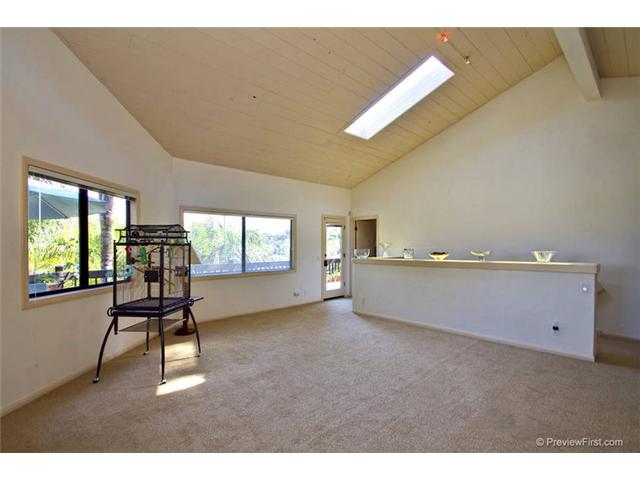 1247 Saxony Road Encinitas, CA 92024 - Photo 9 of 24 Great room with vaulted ceilings, just off kitchen. Let your imagination decide how you would like to use it.