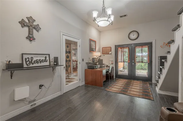 a view of an entryway with wooden floor
