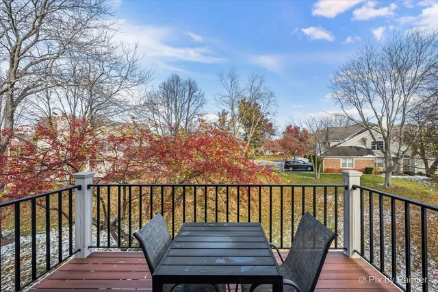 a view of a wooden deck with a bench