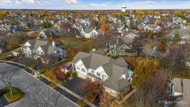 an aerial view of residential houses with outdoor space