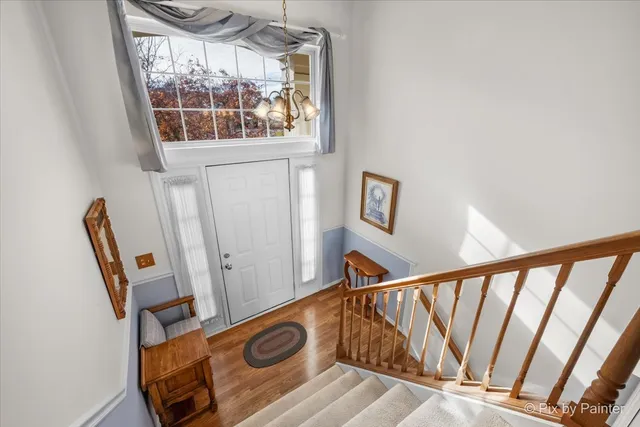 a view of front door with wooden floor