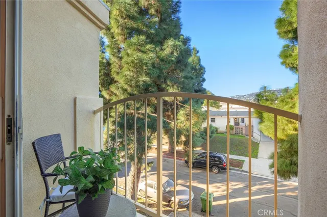 a view of balcony with a potted plant