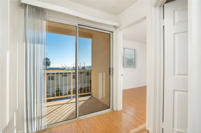 a view of a room with a glass door