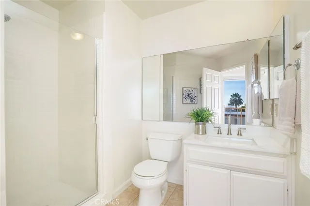 a bathroom with a sink toilet and a mirror