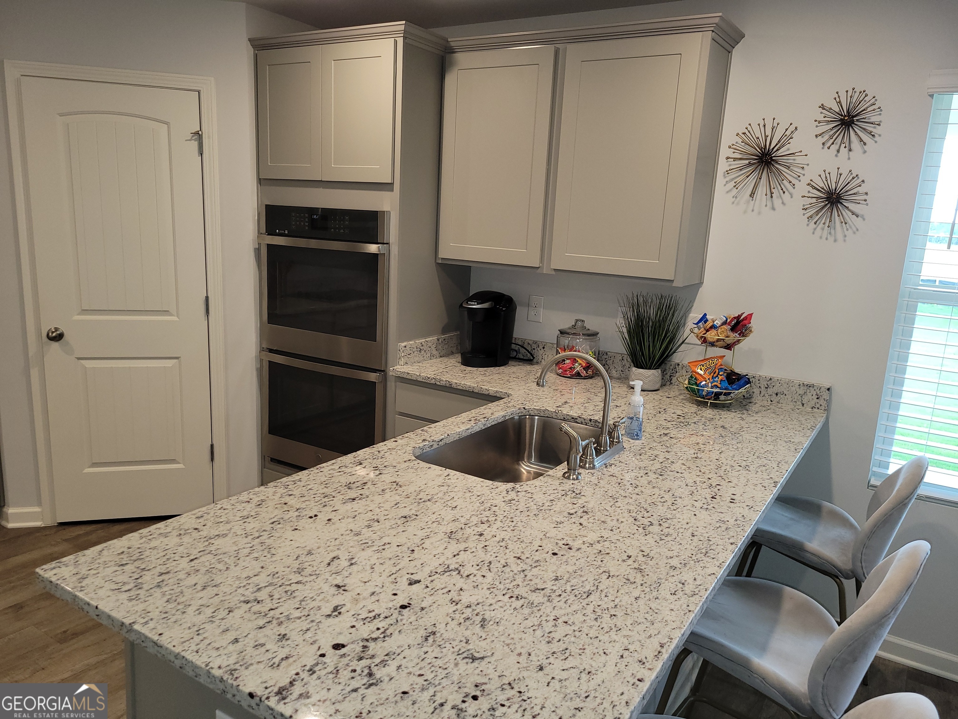 505 Holsteiner Road, Unit 66 Hogansville, GA 30230 - Photo 10 of 11 a kitchen with a sink refrigerator and microwave