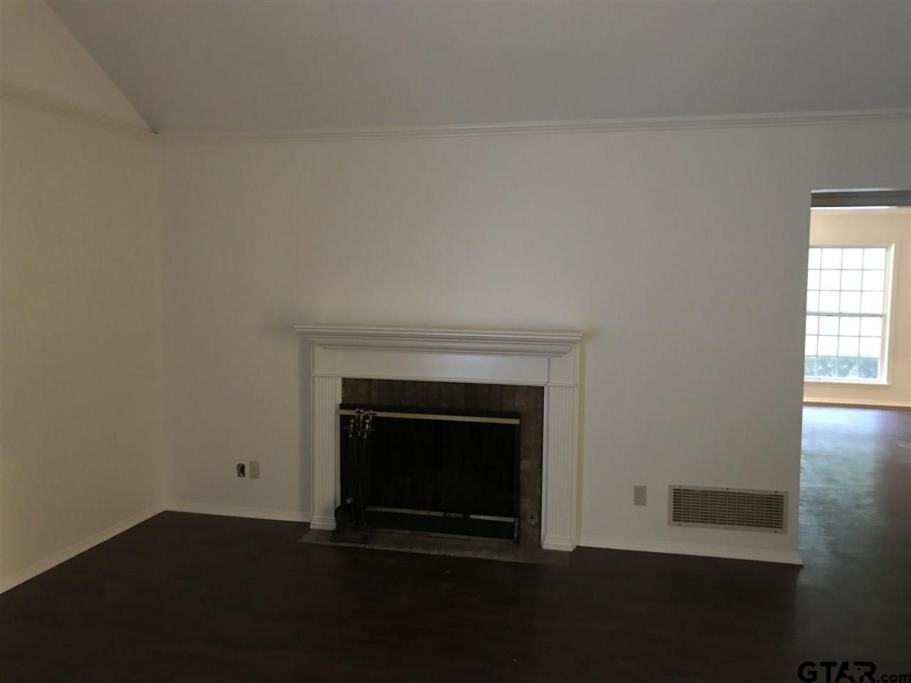3721 Colony Park Drive Tyler, TX 75701 - Photo 4 of 11 a living room with a fireplace