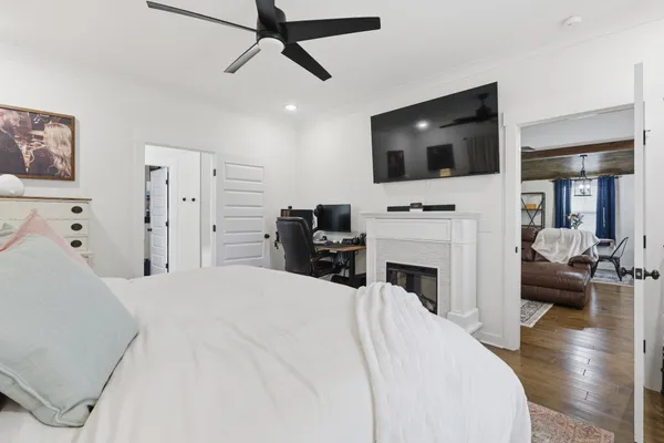 a living room with fireplace furniture and a flat screen tv