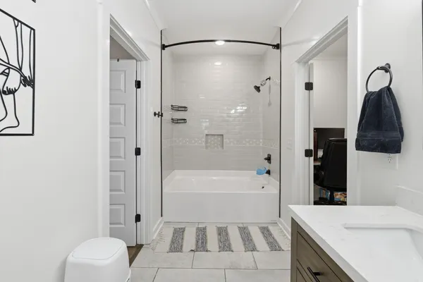 a bathroom with a sink a toilet and a bathtub