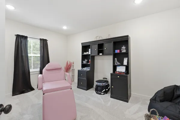 a living room with furniture a ceiling fan and a wooden floor