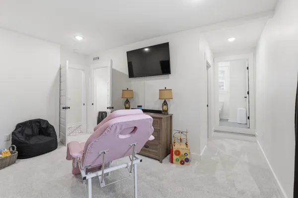 a livingroom with furniture and a flat screen tv