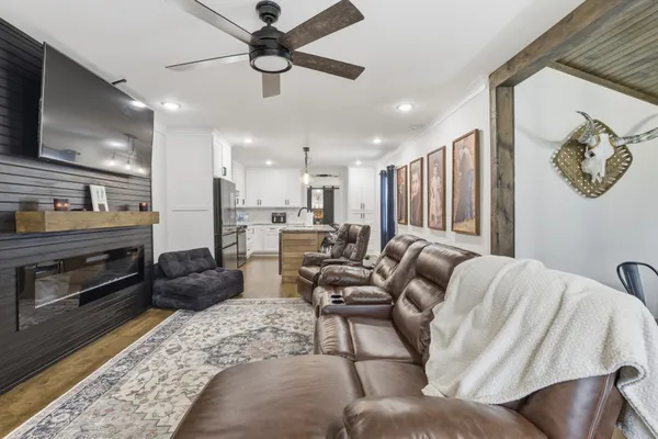 a living room with furniture and a flat screen tv