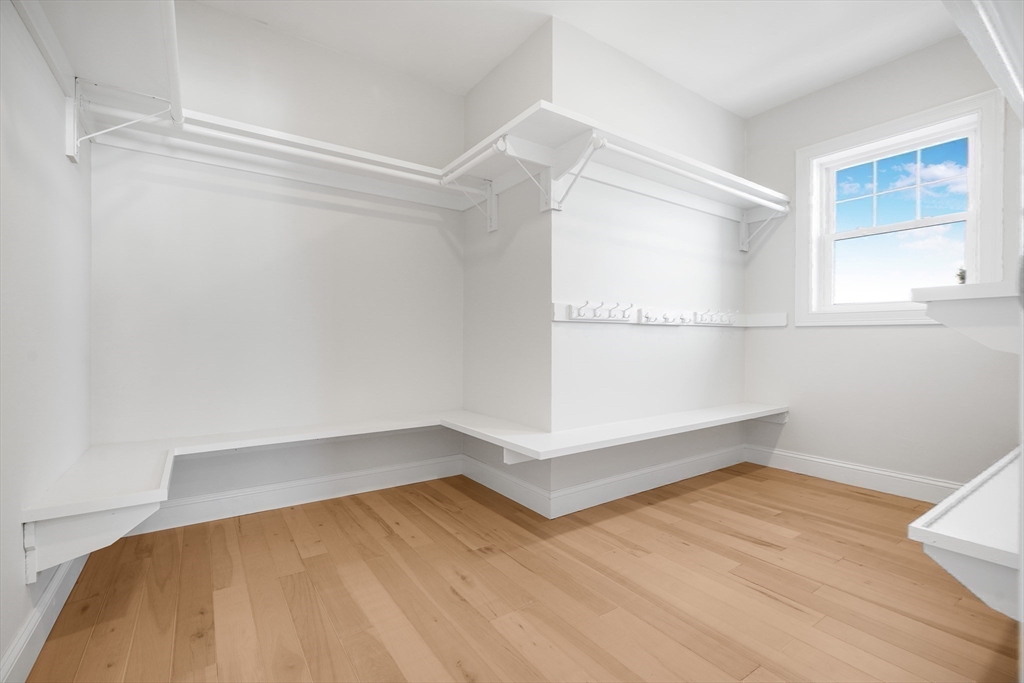 144 Bailey Street Fall River, MA 02724 - Photo 21 of 37 a view of an empty room with wooden floor and a window