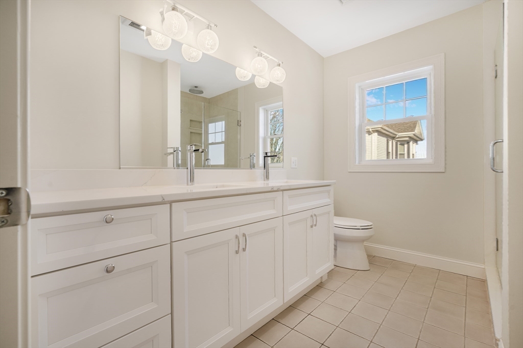 144 Bailey Street Fall River, MA 02724 - Photo 24 of 37 a bathroom with a toilet a sink and mirror