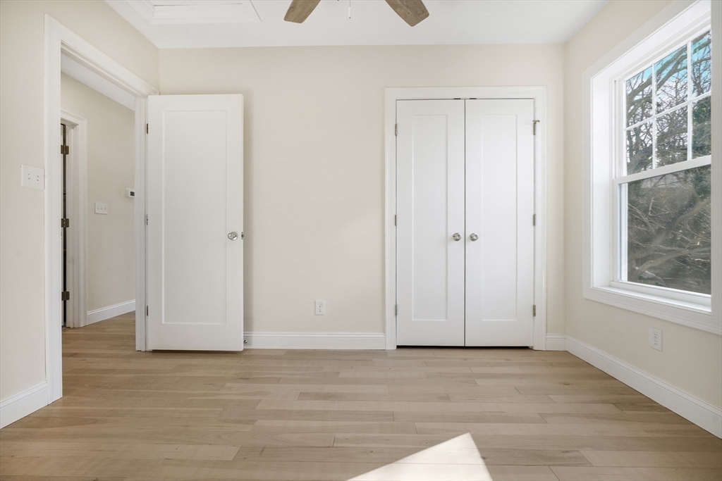 144 Bailey Street Fall River, MA 02724 - Photo 26 of 37 a view of an empty room with window and closet area