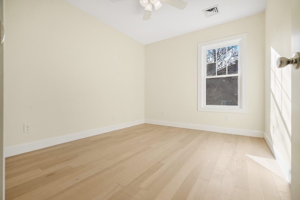 144 Bailey Street Fall River, MA 02724 - Photo 28 of 37 an empty room with a window and a ceiling fan