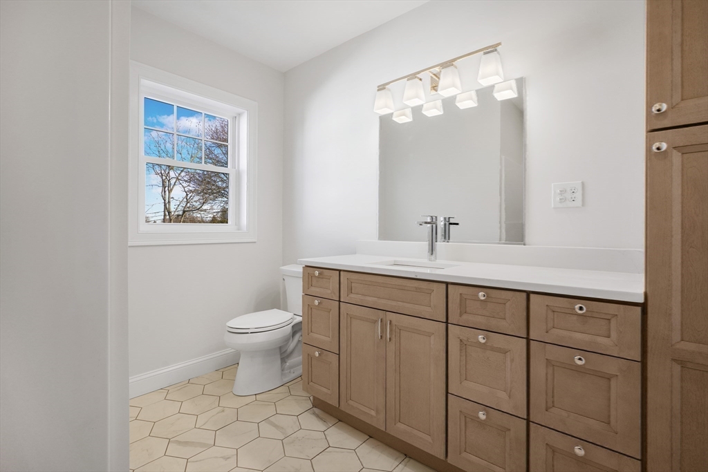 144 Bailey Street Fall River, MA 02724 - Photo 29 of 37 a bathroom with a toilet sink and mirror