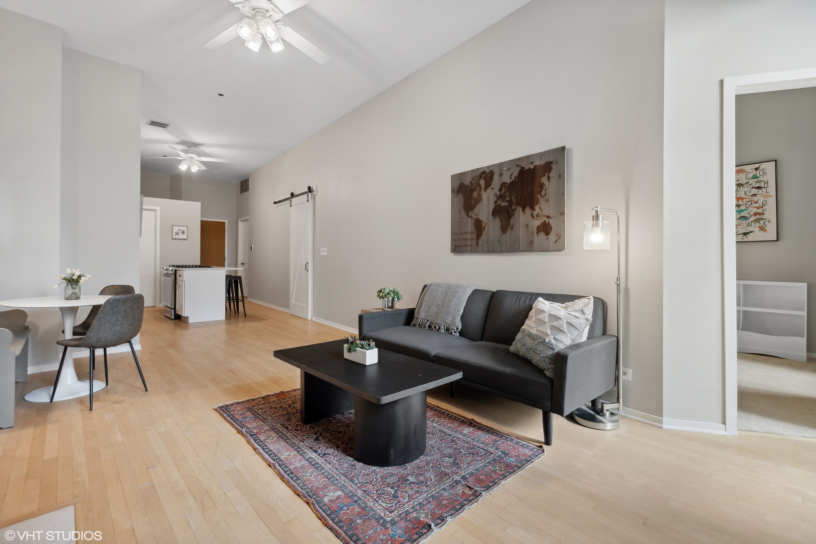 910 South Michigan Avenue, Unit 816 Chicago, IL 60605 - Photo 4 of 21 a living room with furniture and a rug