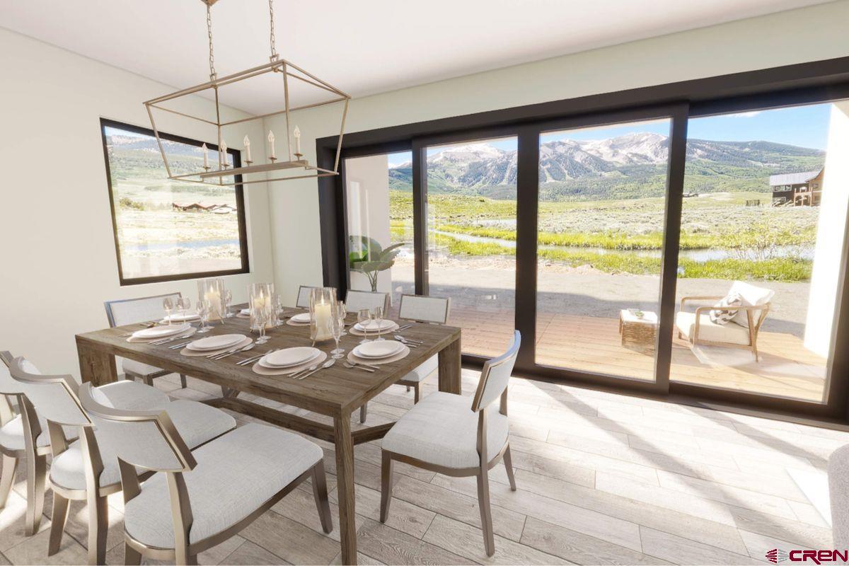 180 Elk Valley Road, Unit 107 Crested Butte, CO 81224 - Photo 29 of 35 a view of a dining room with furniture window and outside view