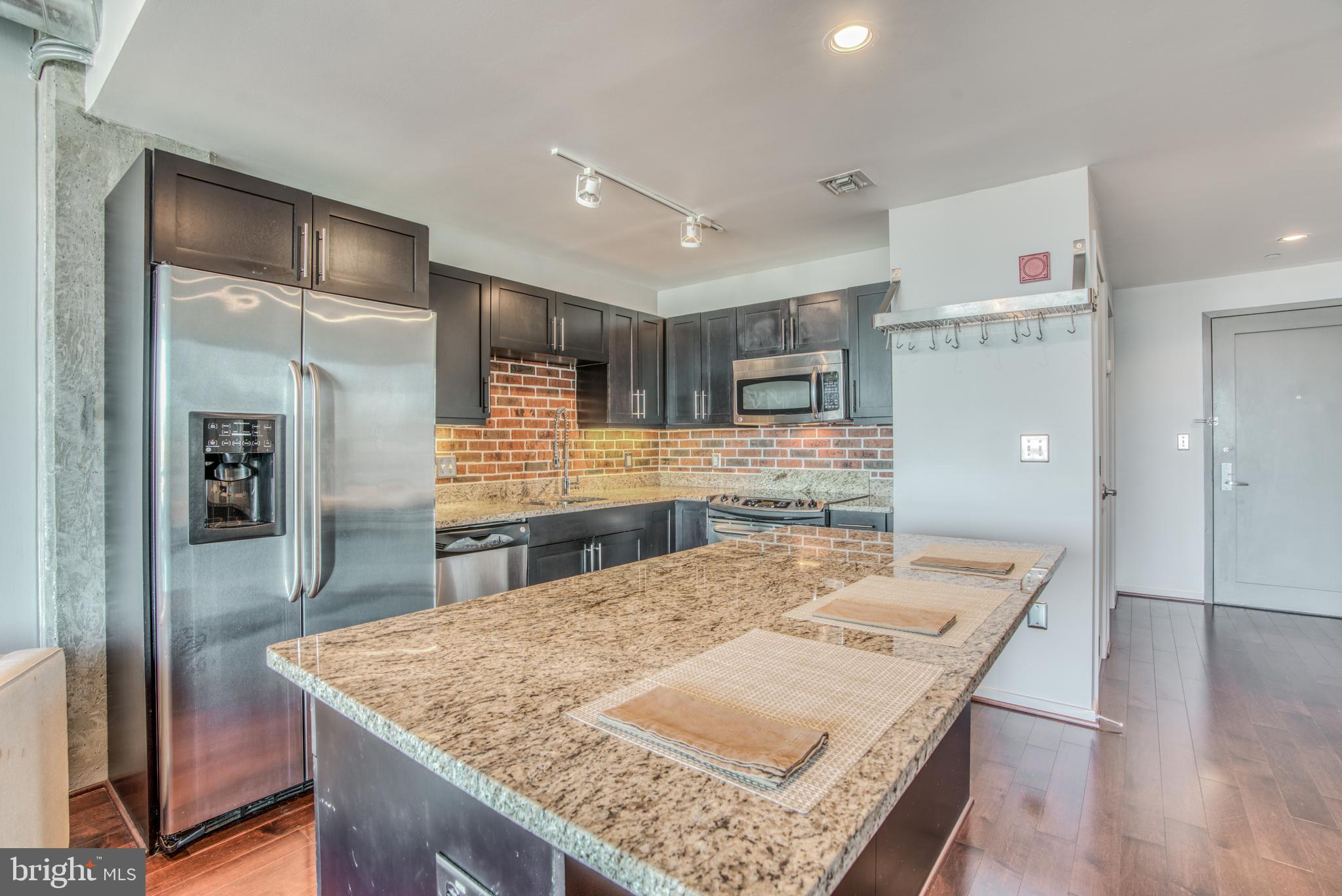 1200 Steuart Street, Unit 430 Baltimore, MD 21230 - Photo 5 of 53 Large open kitchen with stainless appliances