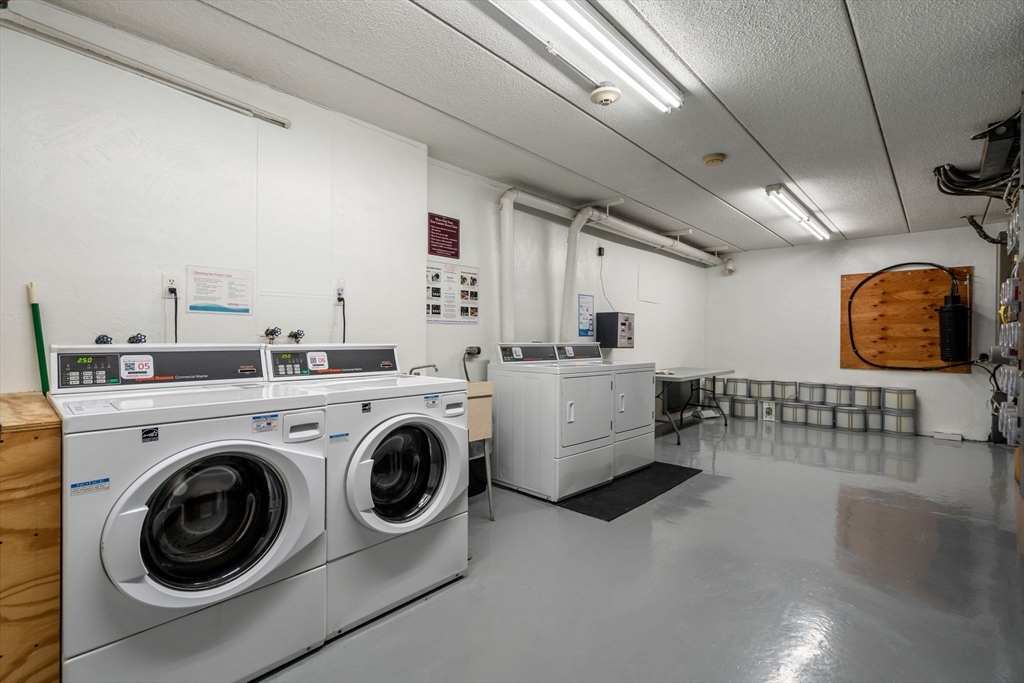 90 High Street, Unit 309 Dedham, MA 02026 - Photo 17 of 20 a view of a storage & utility room with washer and dryer