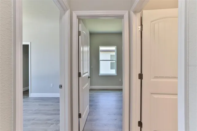 a view of a bathroom from the hallway