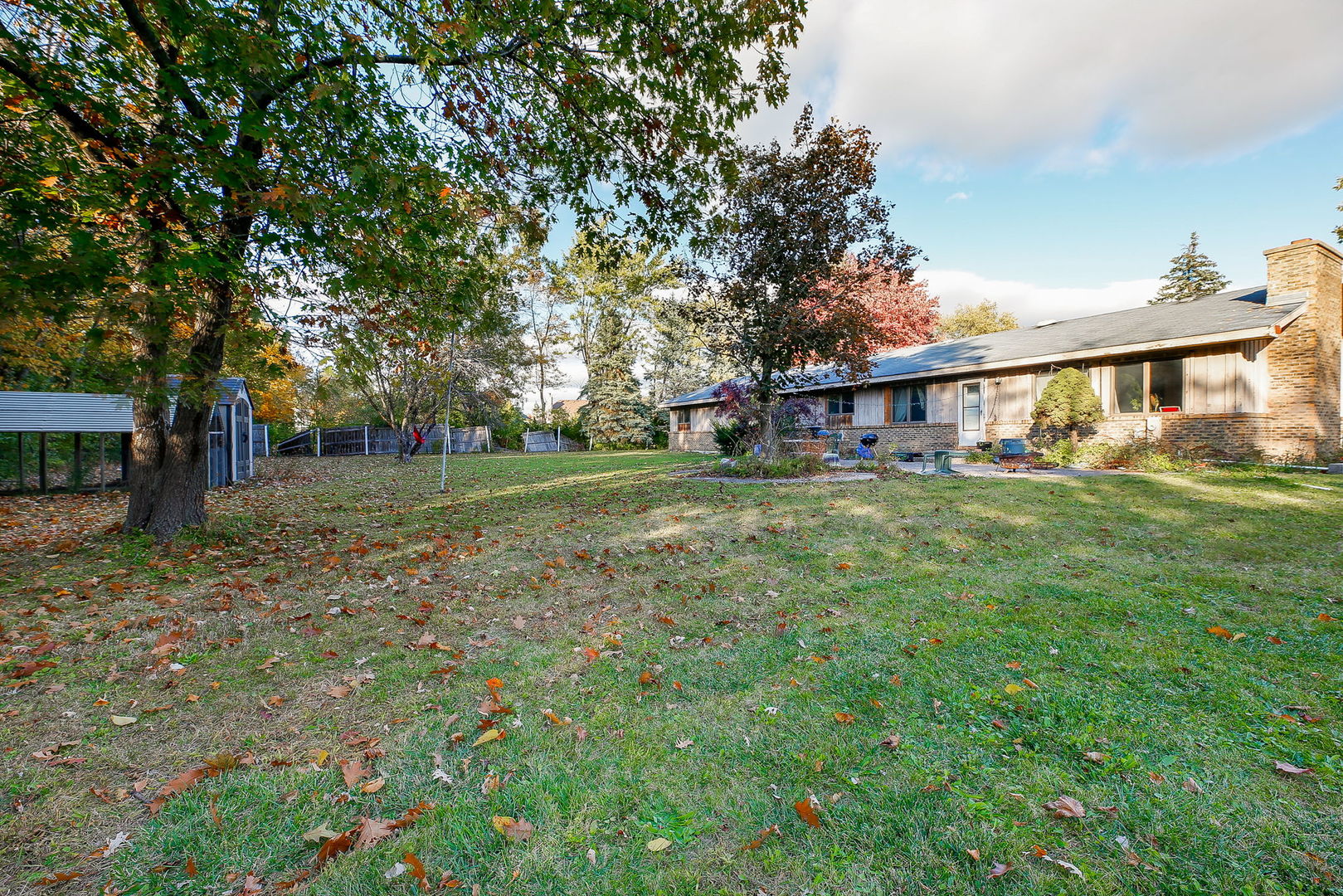 2011 Wagner Road Batavia, IL 60510 - Photo 26 of 29 a view of a house with a big yard and large trees