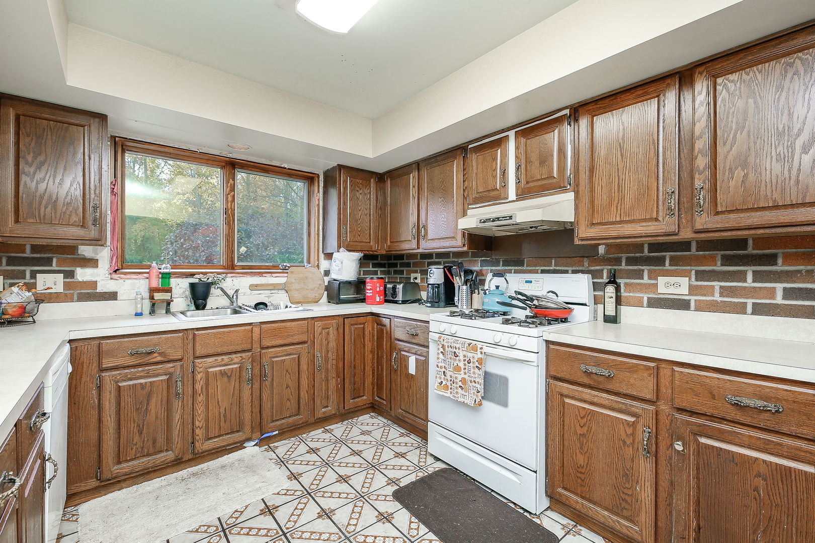 2011 Wagner Road Batavia, IL 60510 - Photo 6 of 29 a kitchen with kitchen island granite countertop a sink window and cabinets