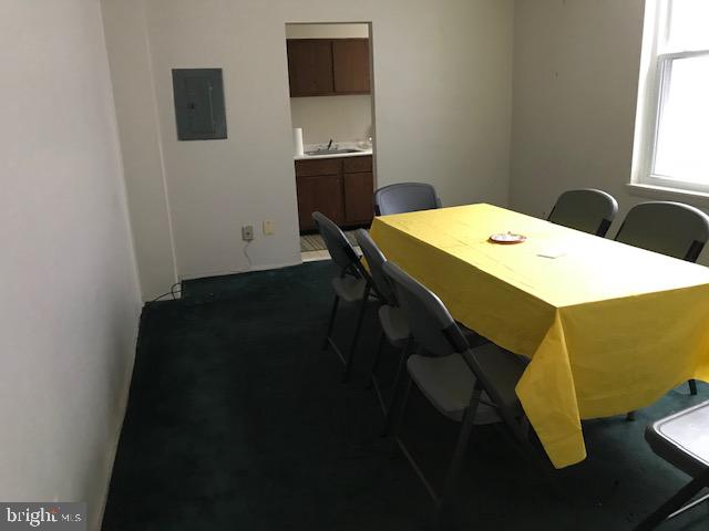 1447 Chapin Street Northwest, Unit 204 Washington, DC 20009 - Photo 3 of 4 a dining room with a table and chairs