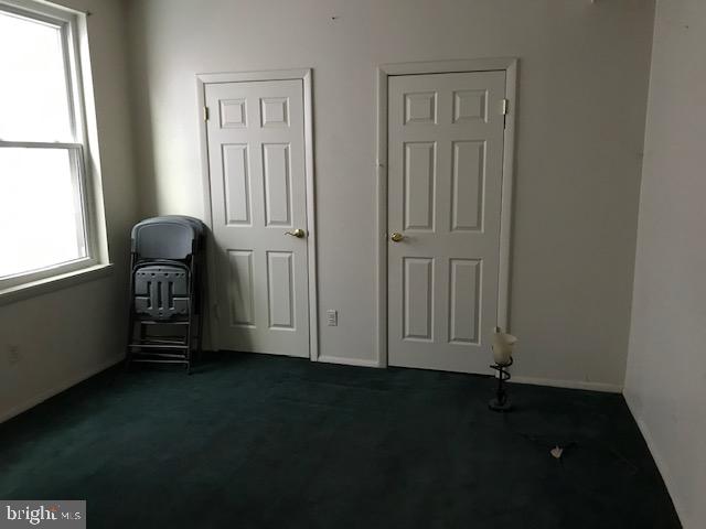1447 Chapin Street Northwest, Unit 204 Washington, DC 20009 - Photo 4 of 4 an empty room with windows
