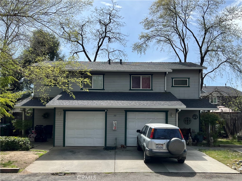 a front view of a house with parking space