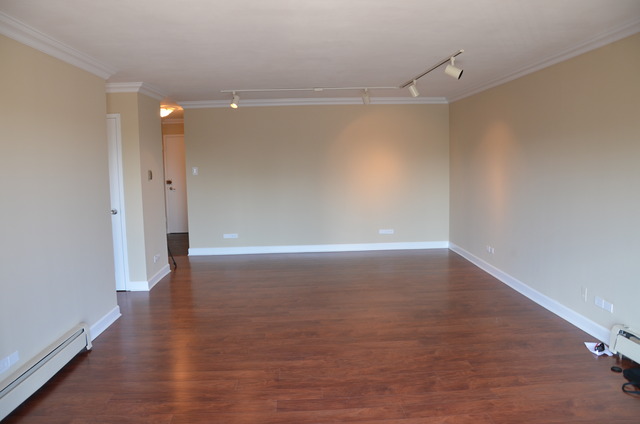 1567 Ridge Avenue, Unit 503 Evanston, IL 60201 - Photo 10 of 17 a view of a room with wooden floor and white walls
