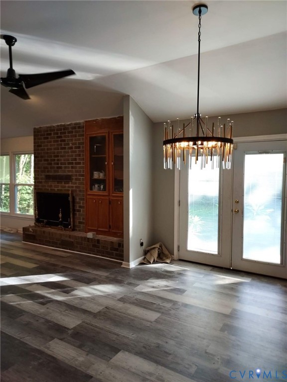 22417 Cox Road Sutherland, VA 23885 - Photo 10 of 22 a view of an empty room with a fireplace and a window