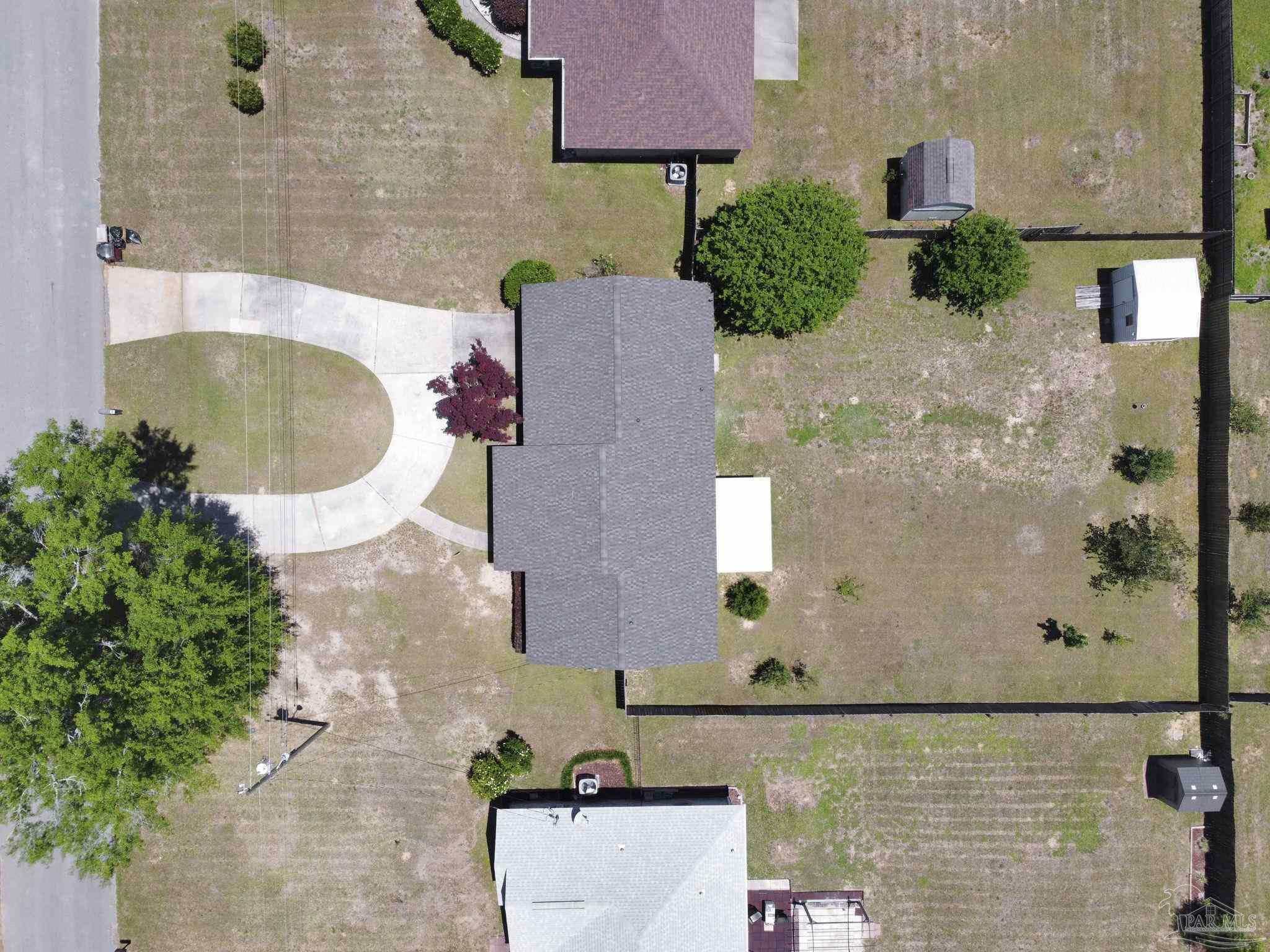 5539 Windrun Place Pace, FL 32571 - Photo 60 of 62 an aerial view of a house with a swimming pool