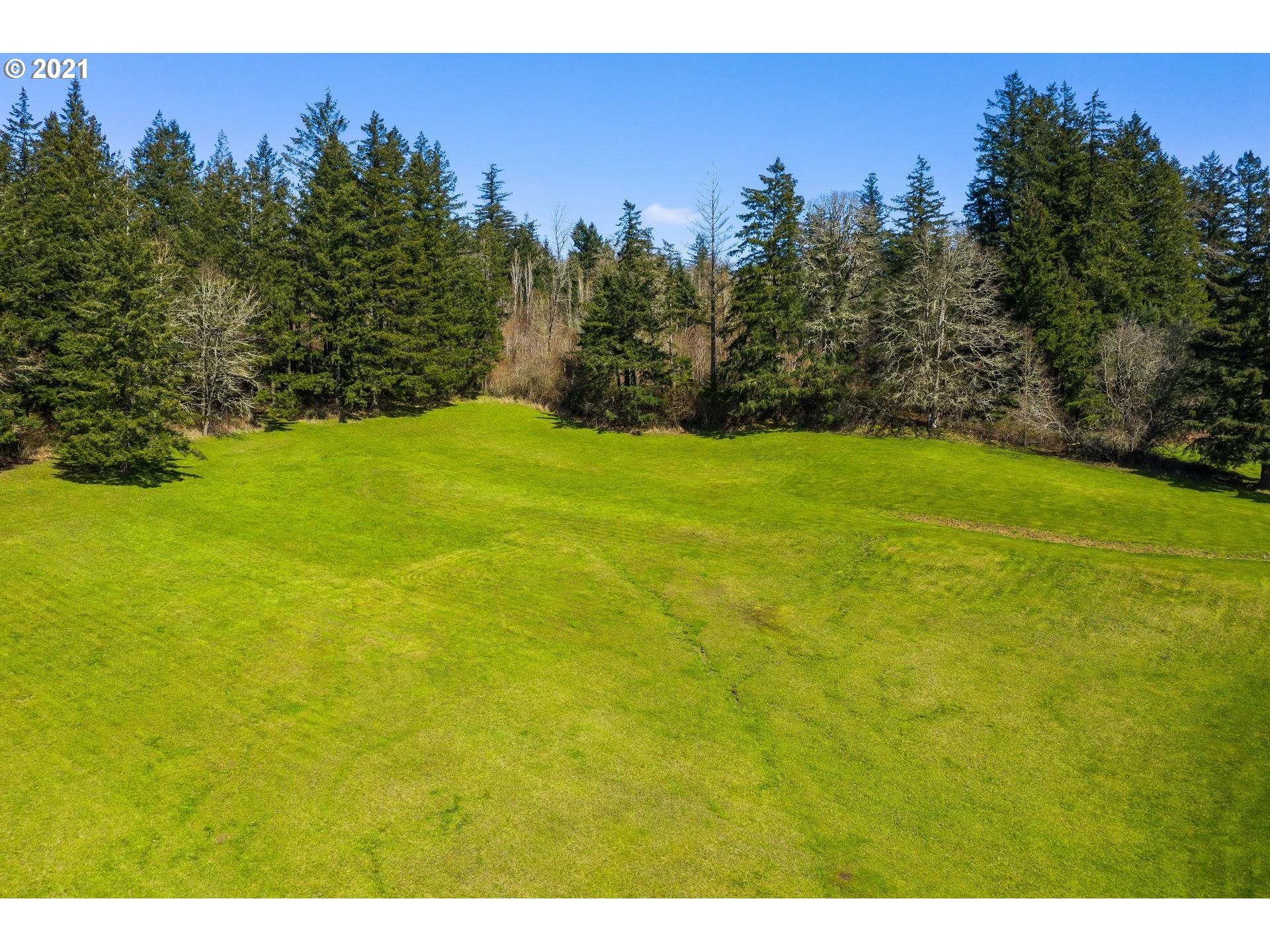 14345 Northwest Germantown Road Portland, OR 97231 - Photo 6 of 10 a view of a big yard with an outdoor space and seating