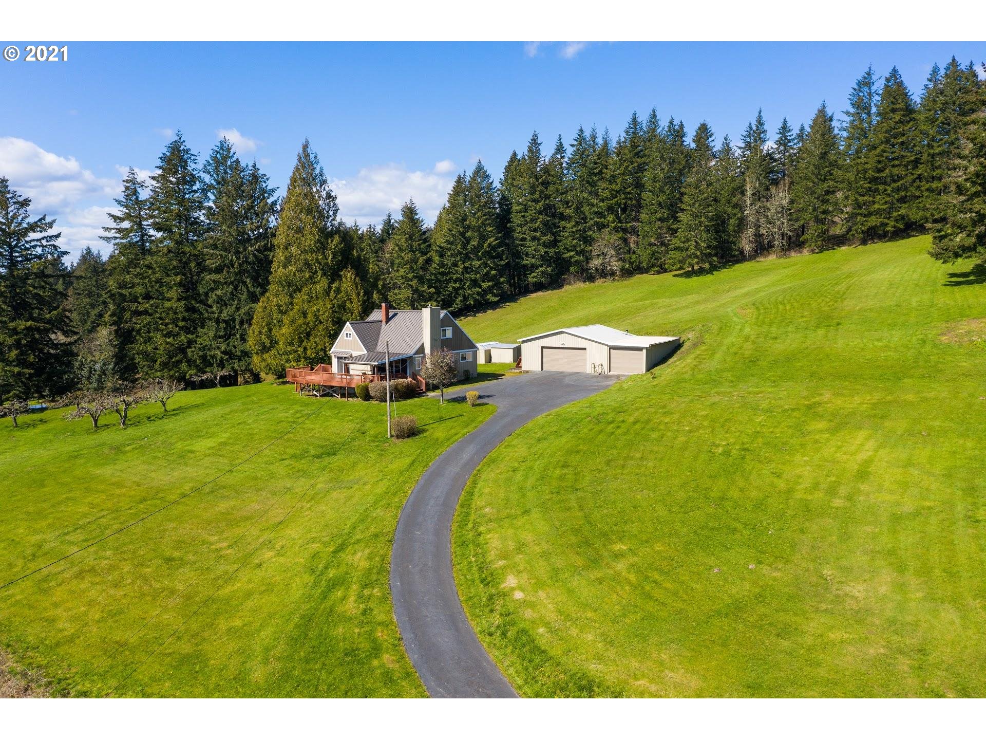 14345 Northwest Germantown Road Portland, OR 97231 - Photo 8 of 10 a view of a swimming pool with a yard