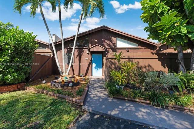 a view of a house with a tree