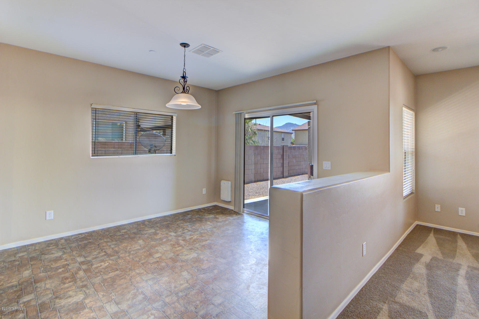 3588 East Mecate Road Tucson, AZ 85739 - Photo 13 of 36 a view of livingroom with window and hallway