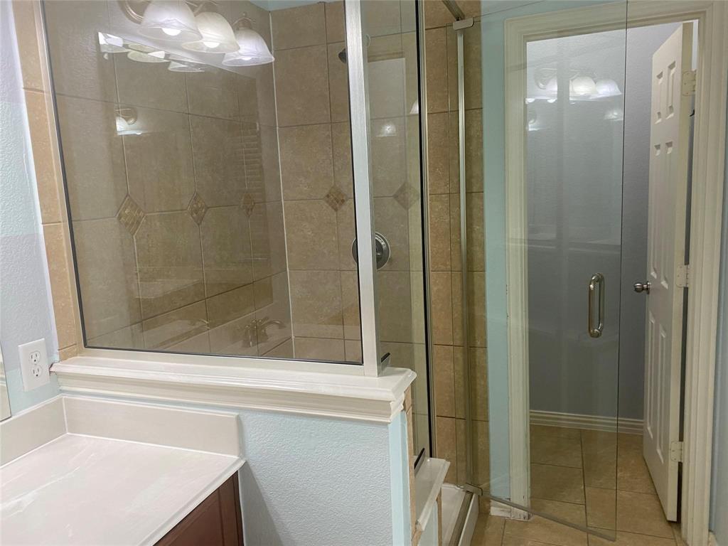612 Catalpa Road Fort Worth, TX 76131 - Photo 16 of 26 a bathroom with a shower and a sink