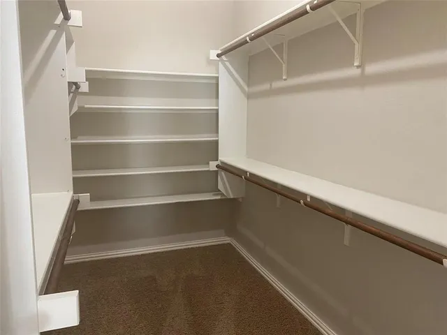 a view of staircase with rug