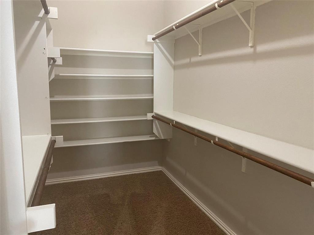 612 Catalpa Road Fort Worth, TX 76131 - Photo 17 of 26 a view of an empty walk in closet