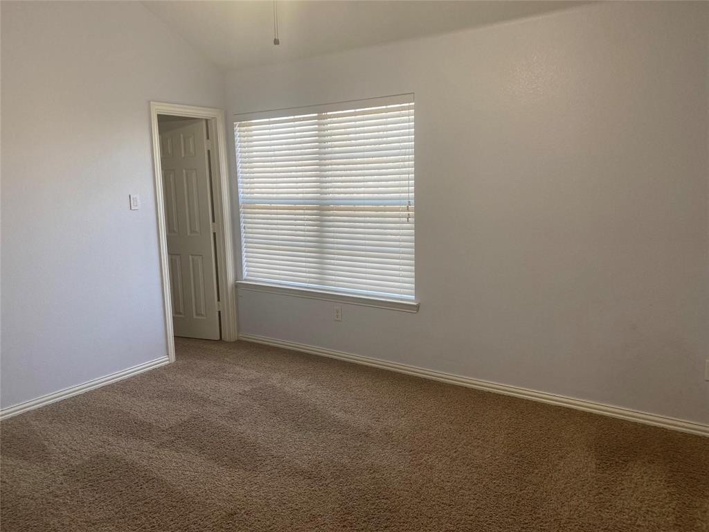 612 Catalpa Road Fort Worth, TX 76131 - Photo 21 of 26 an empty room with a window