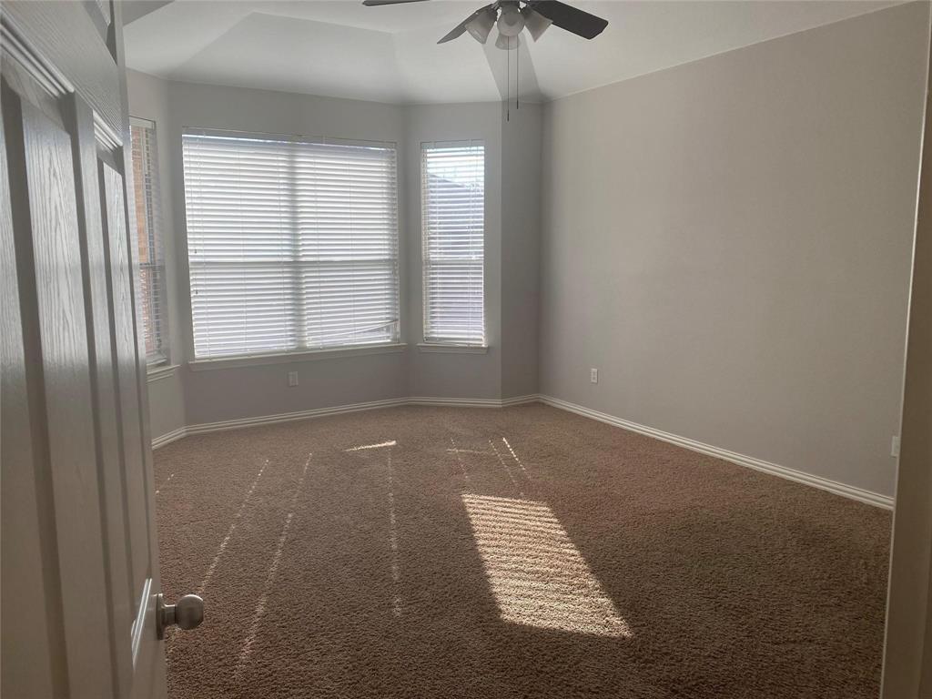 612 Catalpa Road Fort Worth, TX 76131 - Photo 22 of 26 an empty room with a window