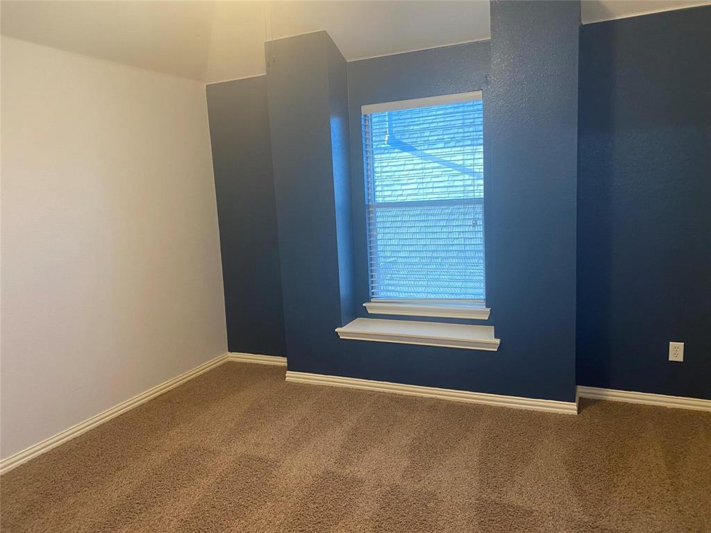 612 Catalpa Road Fort Worth, TX 76131 - Photo 23 of 26 a view of an empty room with a window